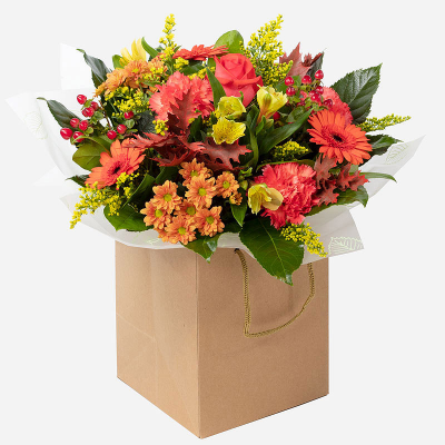 Honey & Spice - Autumn holds some of the most stunning blooms of the year, which can be seen in our beautiful Autumn Sunset hand-tied, featuring a collection of seasonal flowers and foliage that are perfect for any occasion.   
