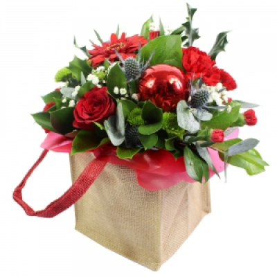 Seasons Greetings - A unique Christmas gift bag, professionally arranged and delivered by a local florist.