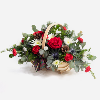 Basket of Joy - This collection of beautiful flowers and seasonal foliage are expertly arranged in a beautiful basket for the perfect Christmas gift.