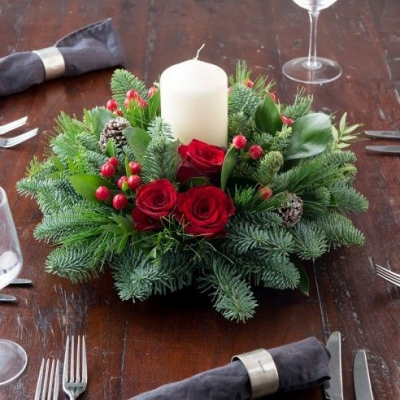 Table Centre Piece - Table Centre Piece made from red roses, festive greenery, berries and a candle
