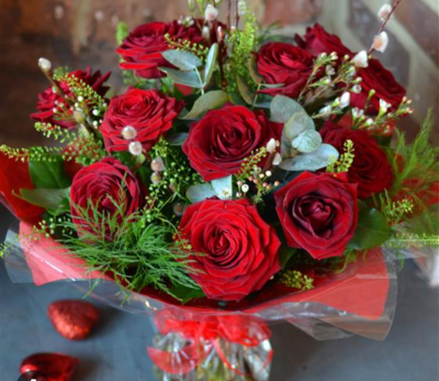 Roses Are Red - 12 Beautiful Red Roses delivered in a gorgeous hand tie with foliage and beautifully presented